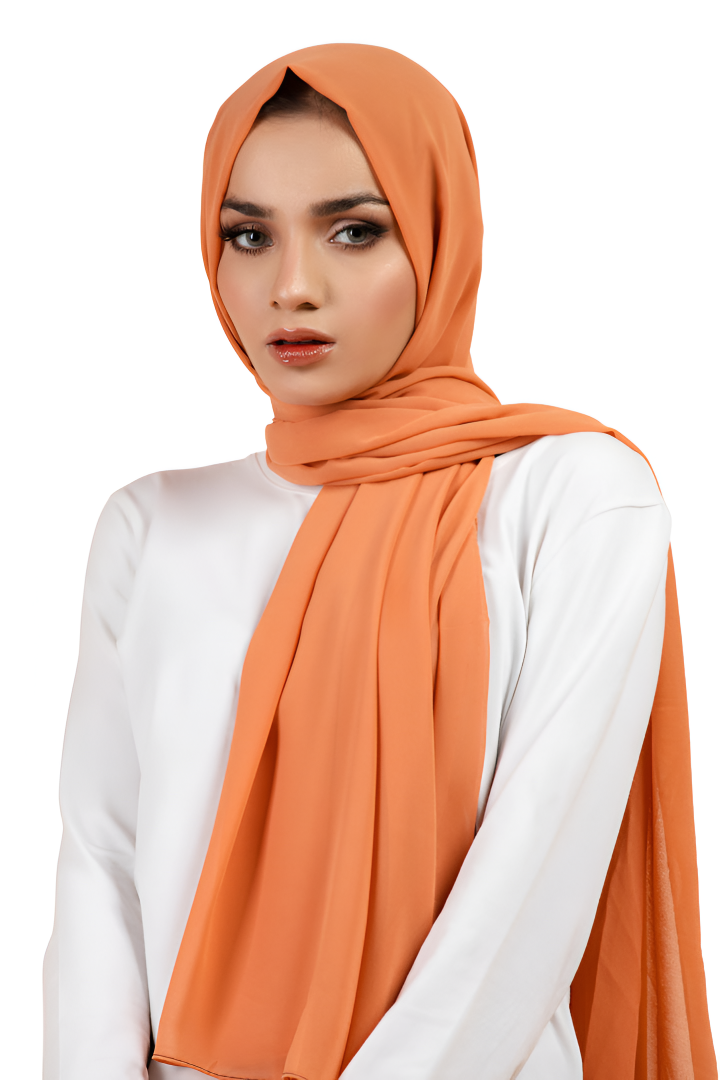 Woman wearing an orange hijab and white top on a white background