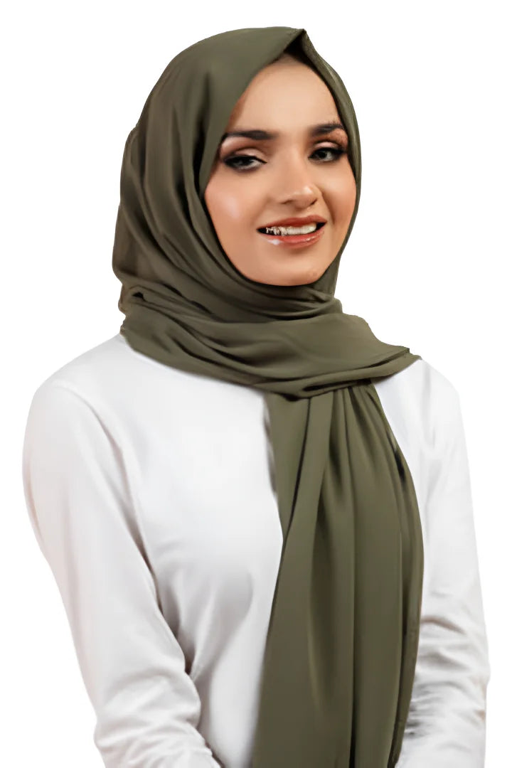 Woman wearing an olive green hijab on a white background