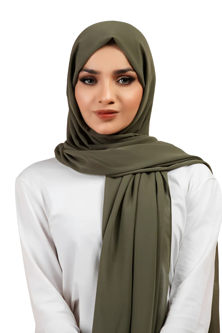 Woman wearing an olive green hijab on a white background