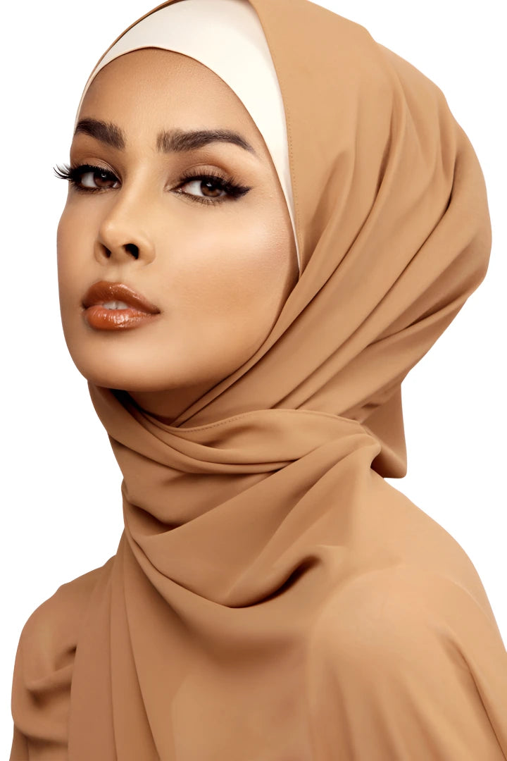Woman wearing a brown hijab on a white background